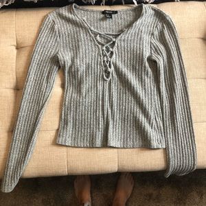 Green sweater with neck strap design